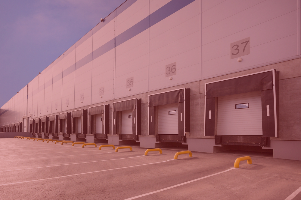 back of a third party logistics order fulfillment center in a pink hue